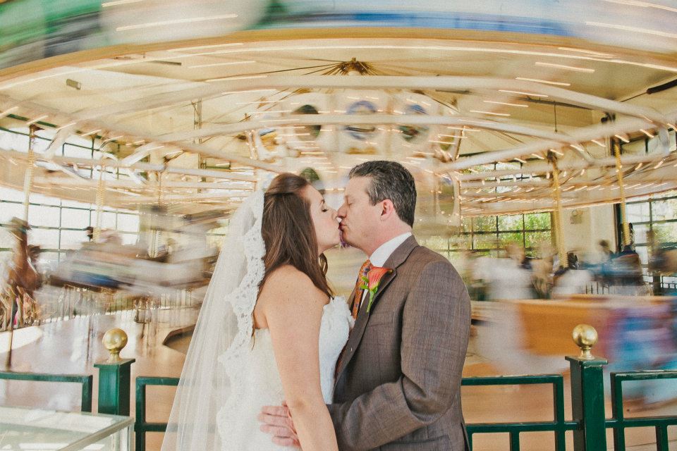 bride groom santa barbara carousel kissing