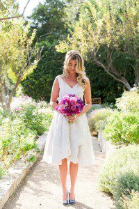 style me pretty jen rodriguez bride san ysidro ranch pink flowers purple short dress silver